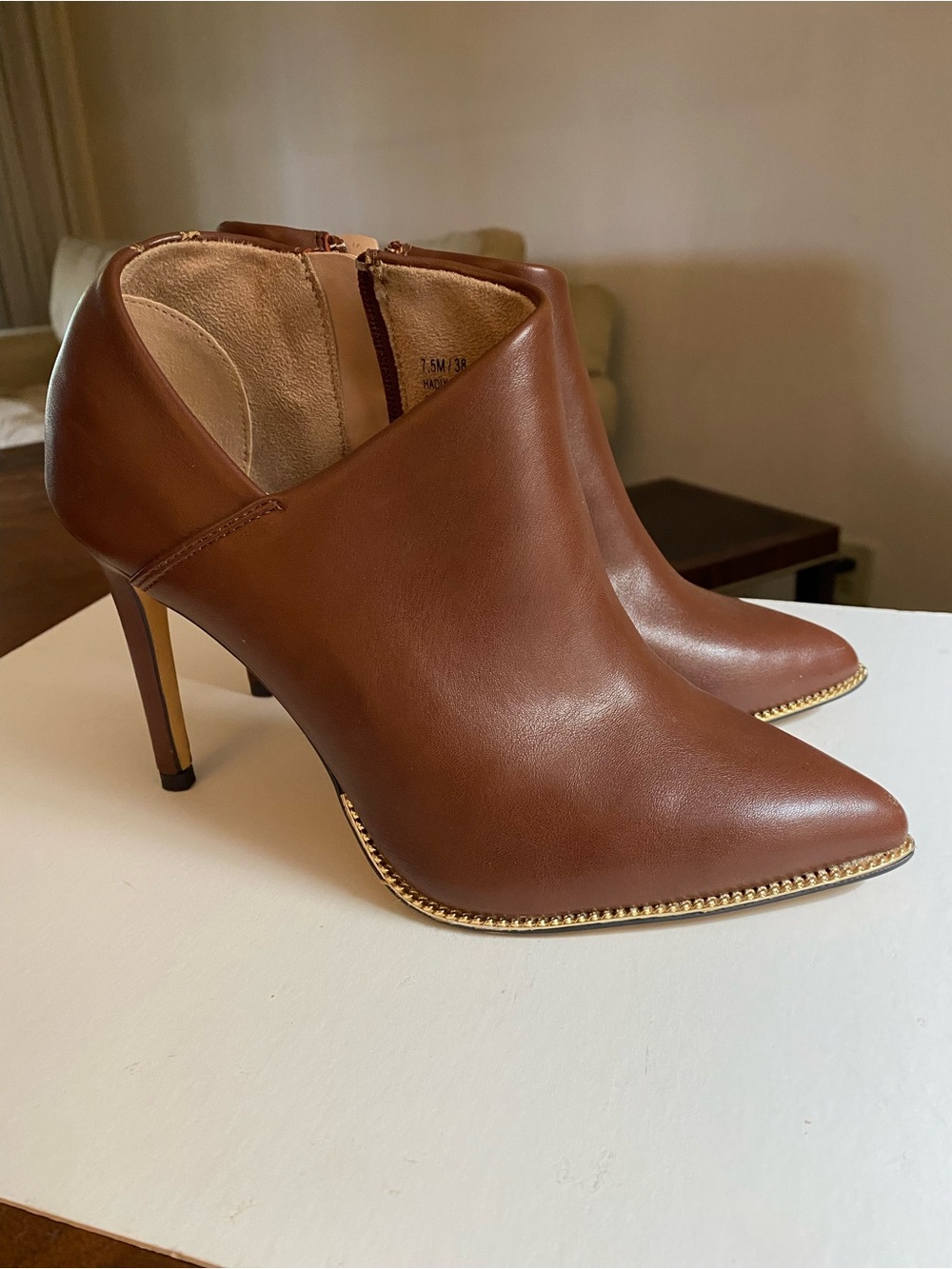BCBGeneration Hadix Cognac Brown Pointed-Toe Ankle Booties with Gold Trim